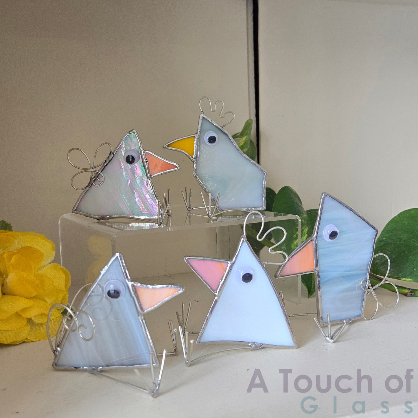 The whimsical scrap glass bird is colourful, charming and imaginative exuding a playful and fanciful aura with its quirky design and delightful character. Sold individually white tones in various shapes.