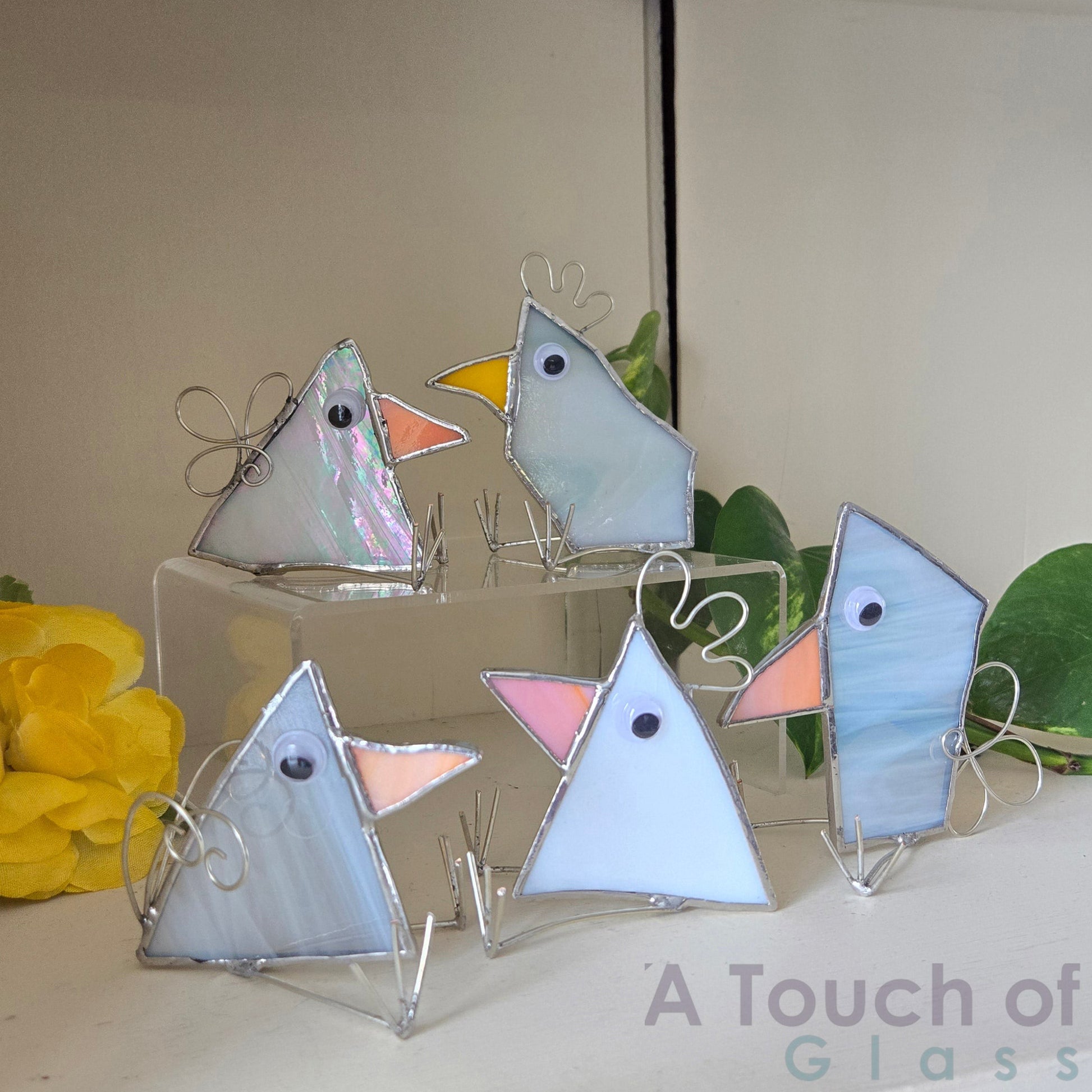 The whimsical scrap glass bird is colourful, charming and imaginative exuding a playful and fanciful aura with its quirky design and delightful character. Sold individually white tones in various shapes.